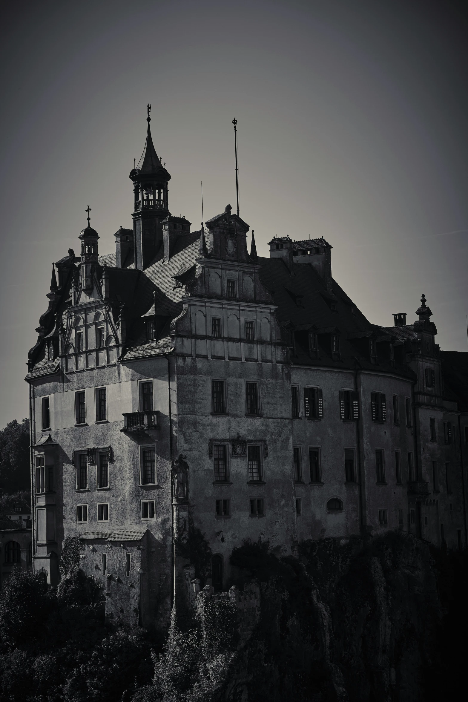 old building is surrounded by large windows and a steeple