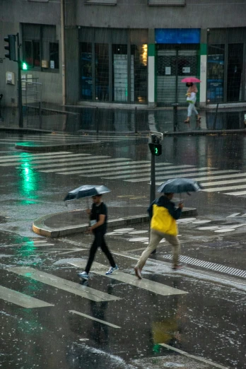 people walking in the rain, with umbrellas