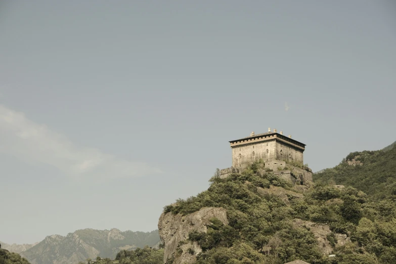 the sky over a tower on a small cliff