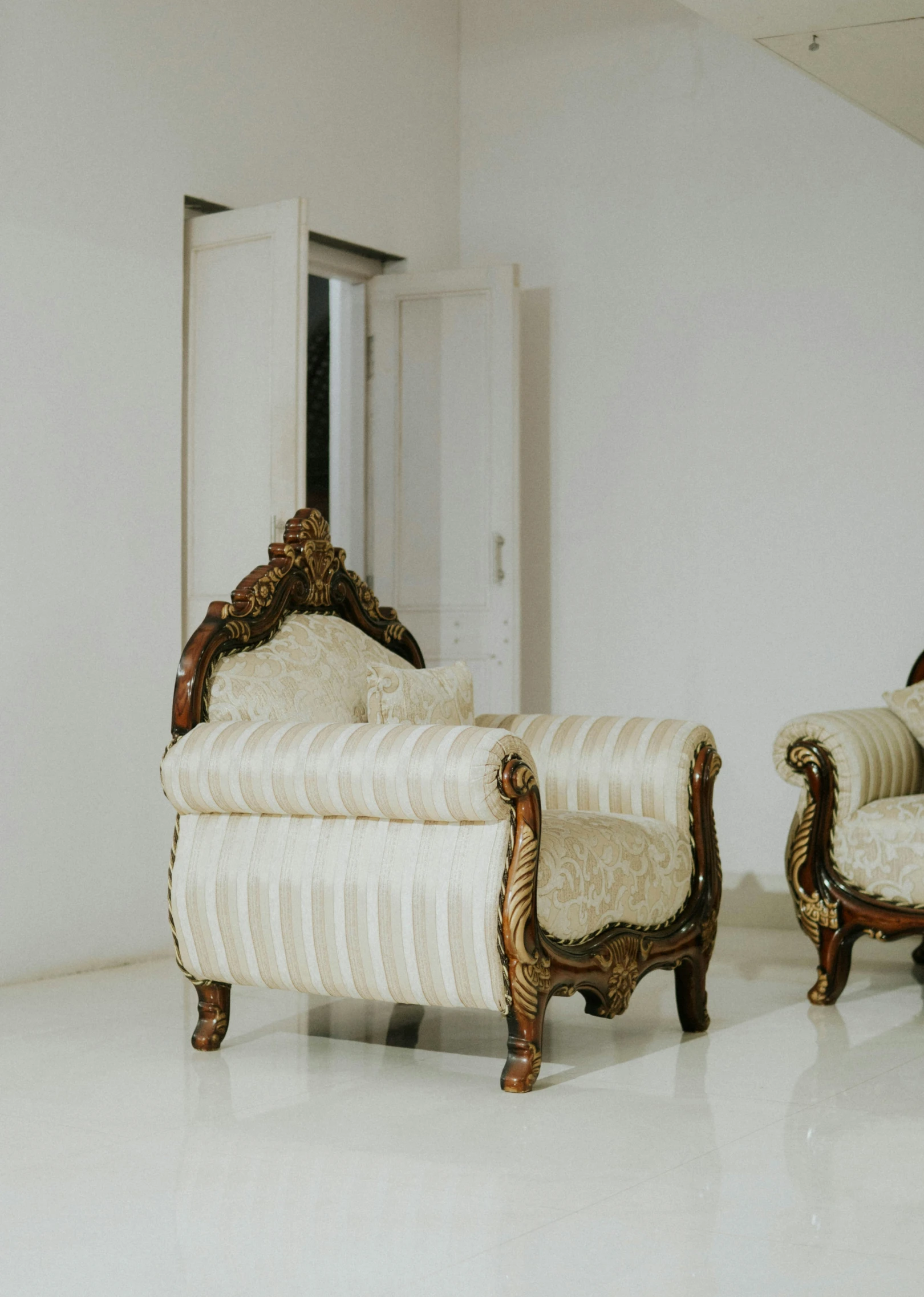 a chair and a couch in a white room