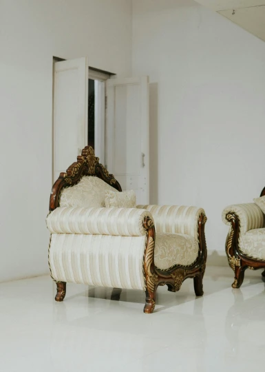 a chair and a couch in a white room