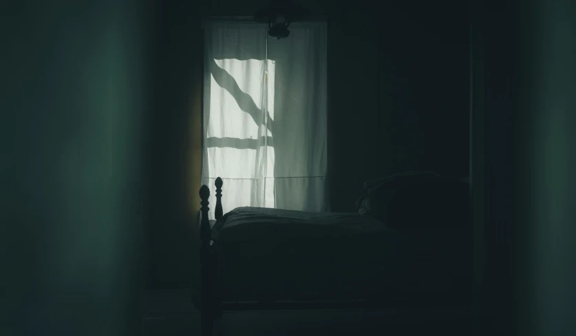 an image of light coming through a window into a bed