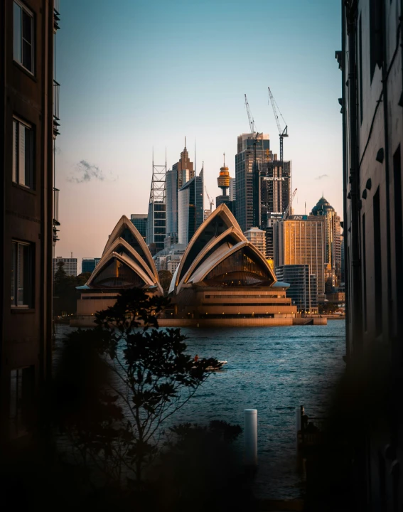 the city has tall buildings along a waterfront