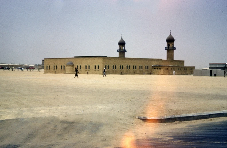 a building with three domes that are brown