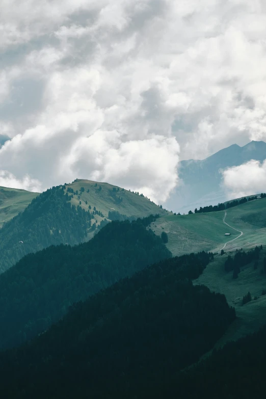 a plane flying over a mountain and some mountains