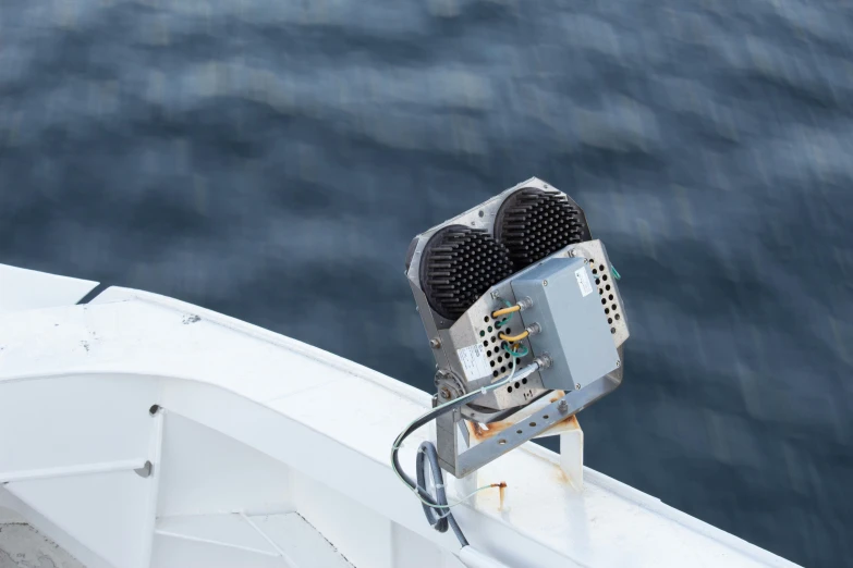 a close up of a fan on the side of a boat