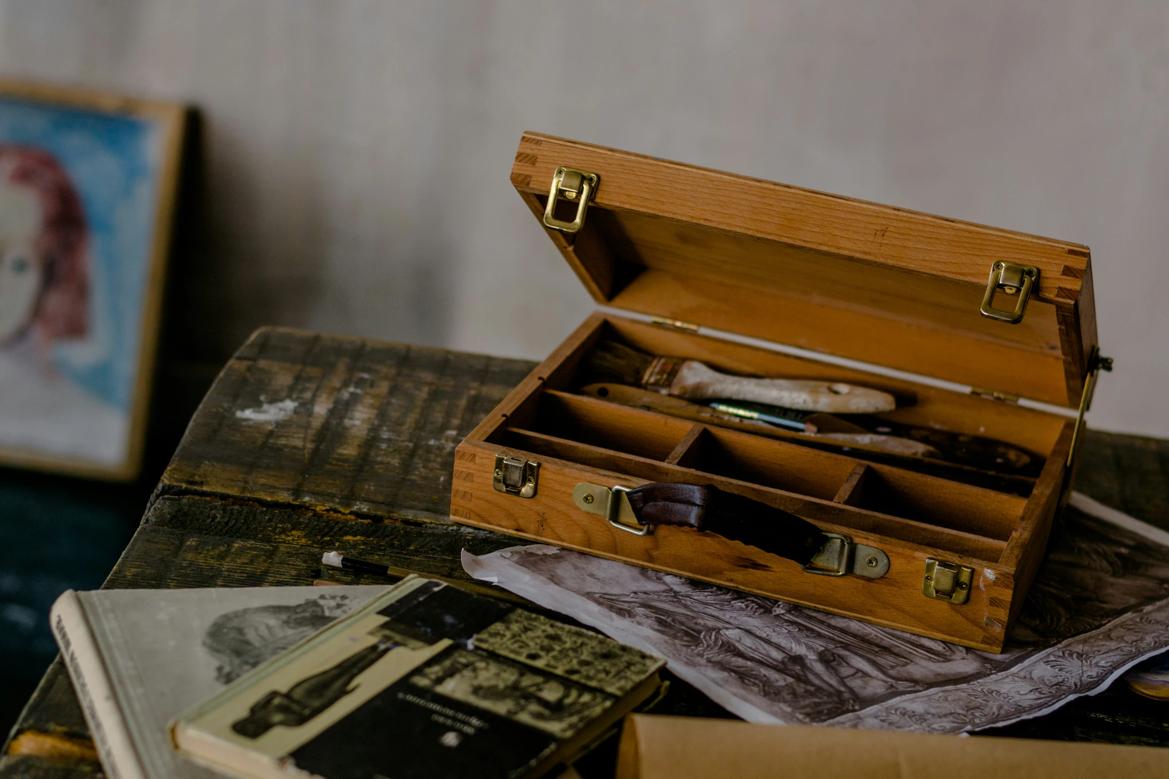 some old fashioned items sit in a wooden box