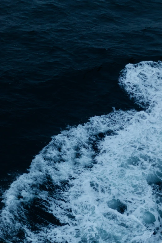 the view from a boat in the water over a wave