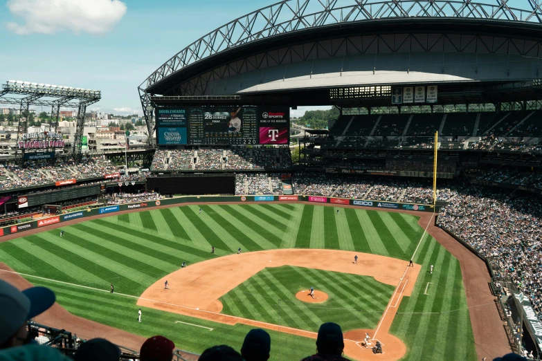 a stadium full of people with baseball players