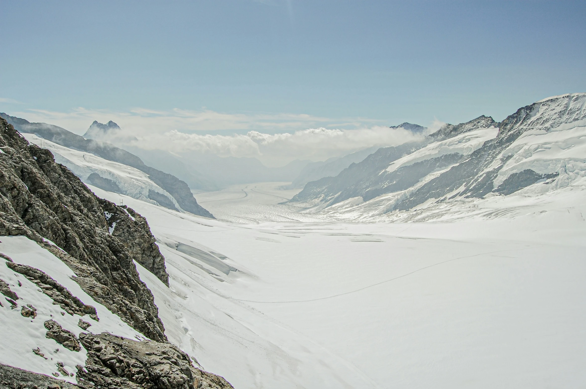 a mountain covered in snow and white mountains