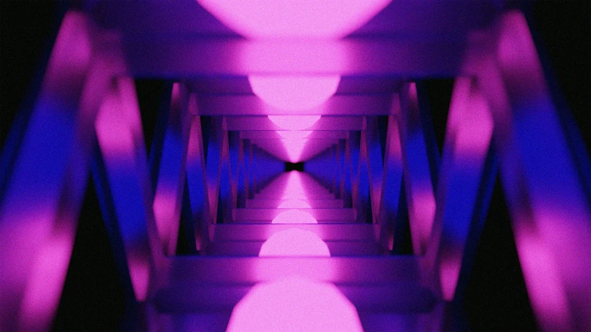 a very long bridge has many purple lights on it