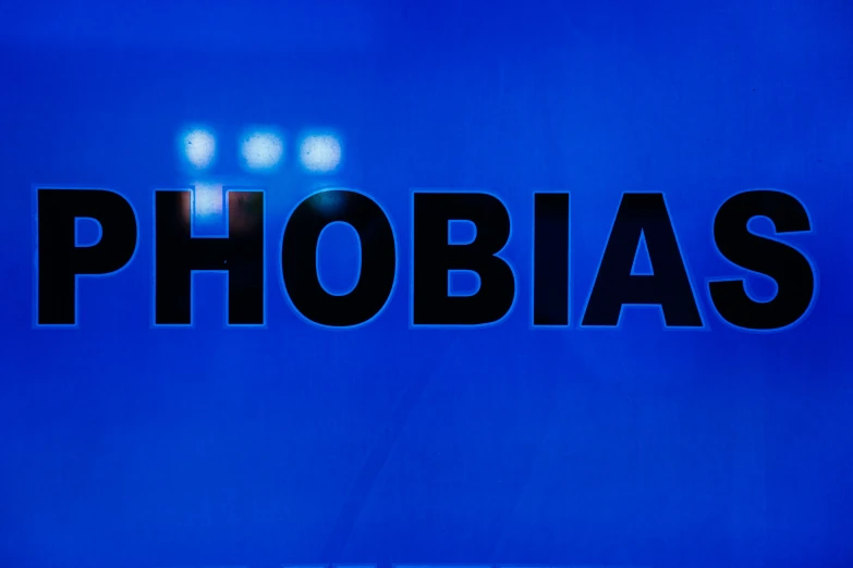 a sign for phobas on a blue wall