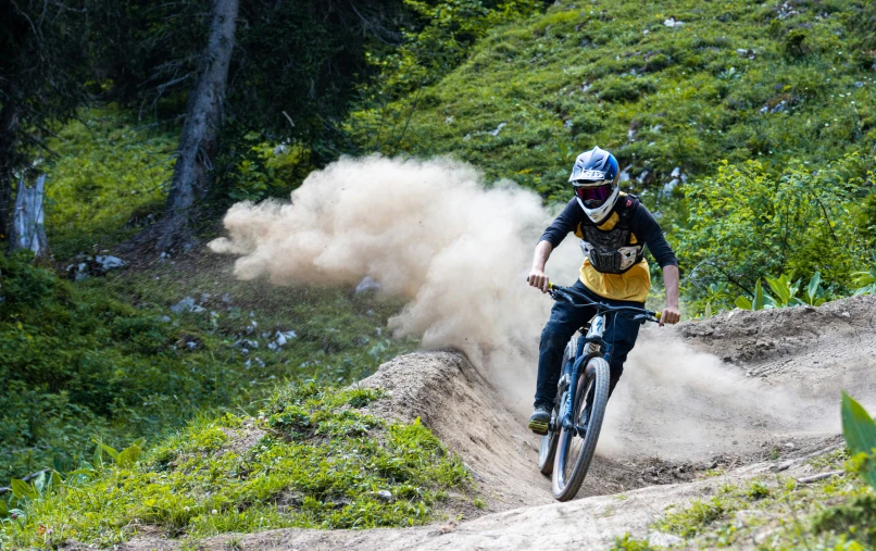 a person on a bike kicking up dust