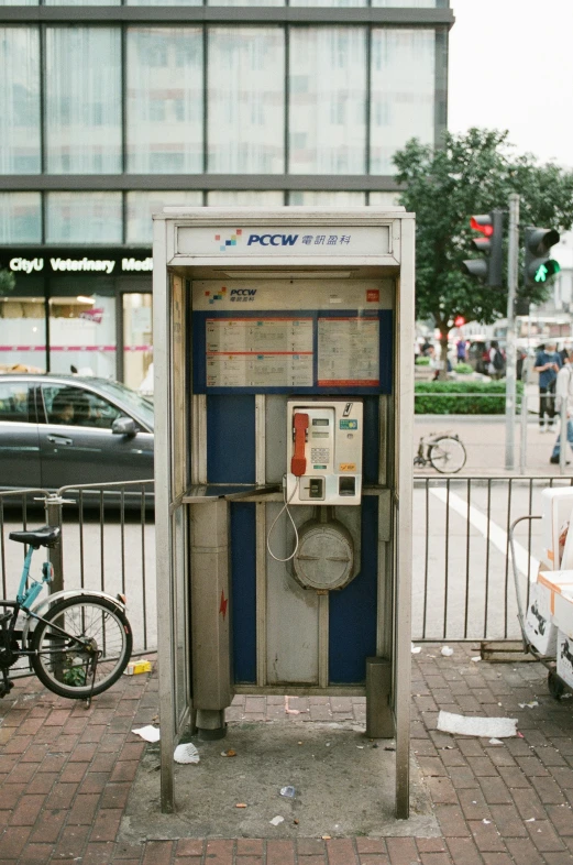 there is a parking meter on the side of a street