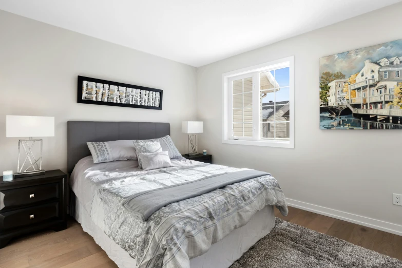 an empty bedroom with white walls and gray carpeting