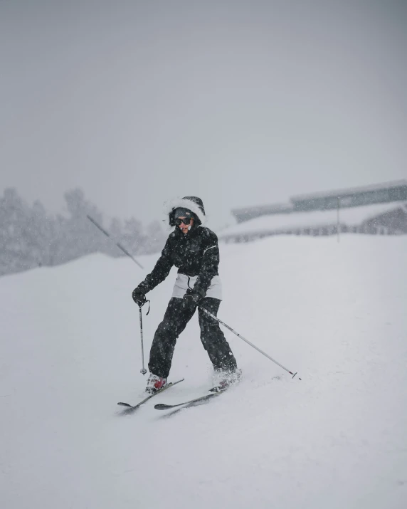 this woman is skiing in deep snow on a hill