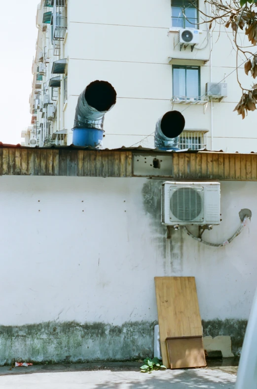 a building with two fans on top of it