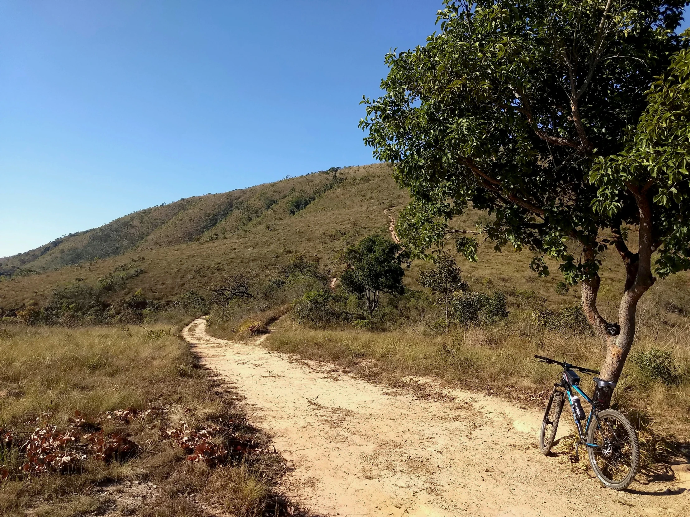 bike parked on the road in the mountain side