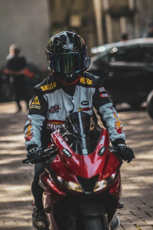 a person in a helmet on a red motorcycle