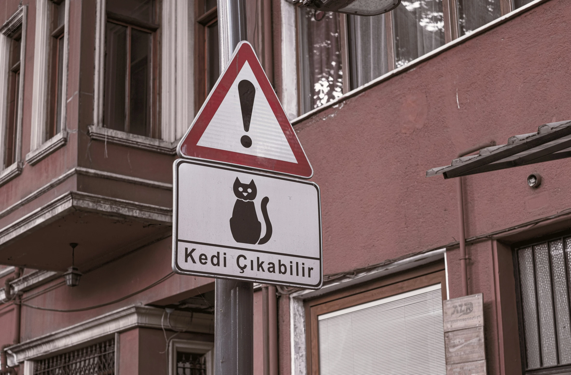 a sign that reads keep gitabili in front of a building