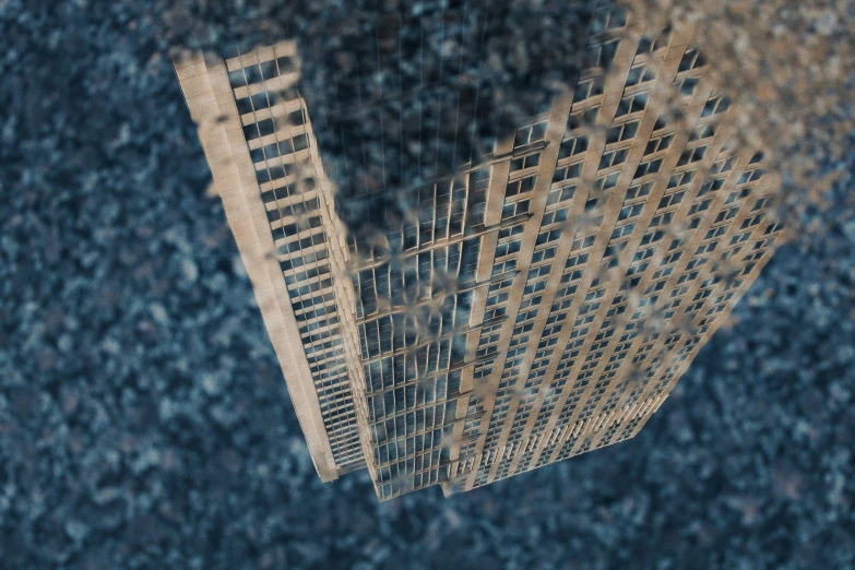 the reflection of a building in a dle of water