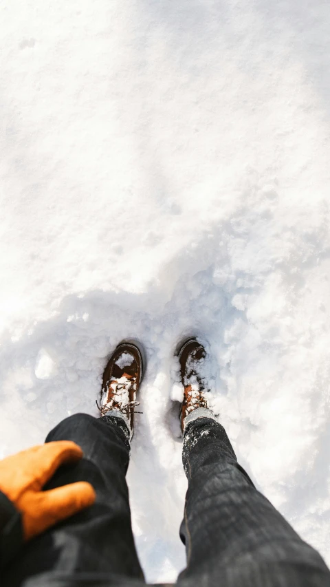 someone is standing in the snow on one foot