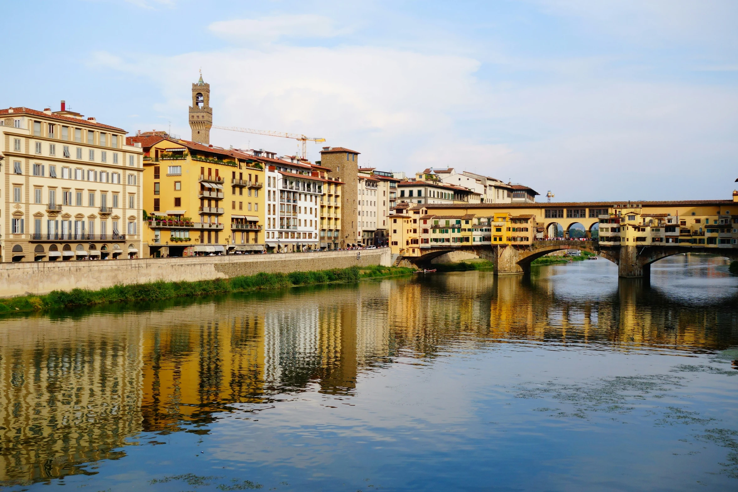 a body of water with a bridge above it