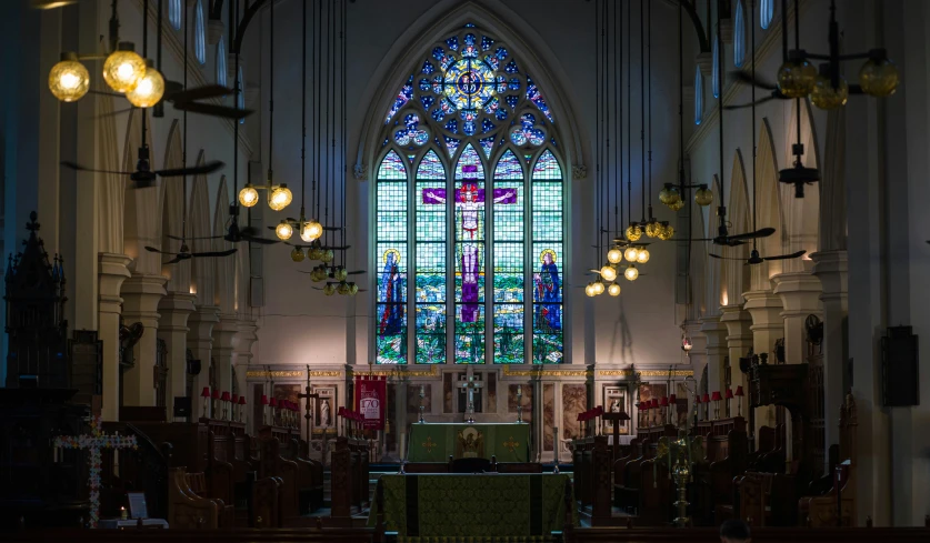 a church with a tall stained glass window