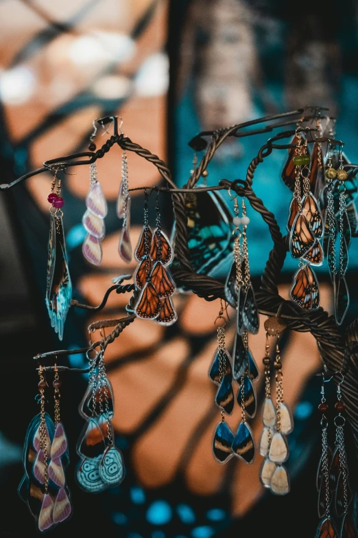 a group of earring hanging from a tree nch