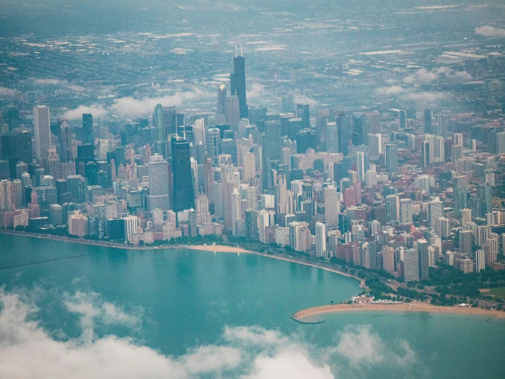 an aerial view of a city and its surrounding water