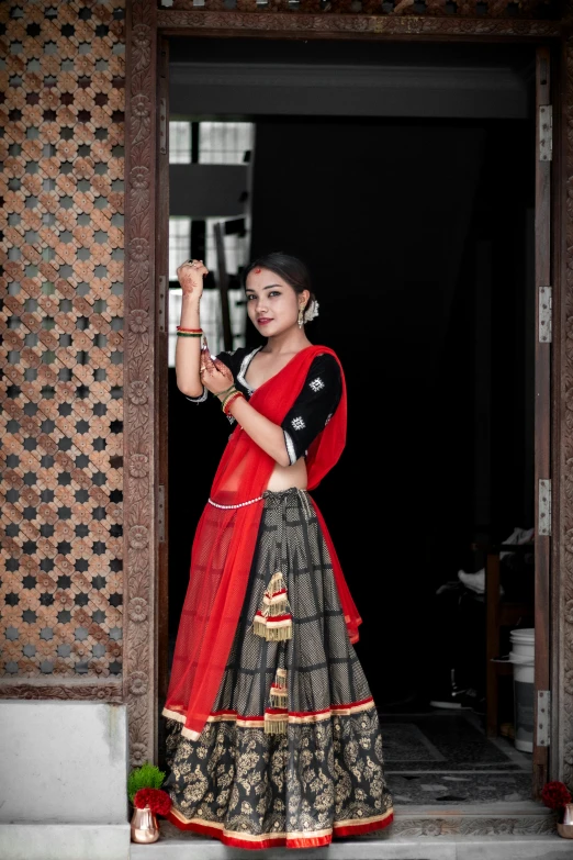 a woman wearing a black skirt standing on stairs