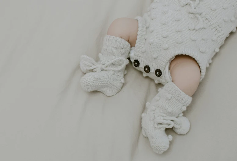 baby girl's white dress with stockings and shoes
