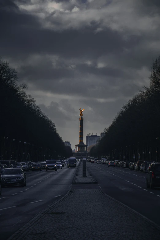 this is an image of a street lined with parked cars