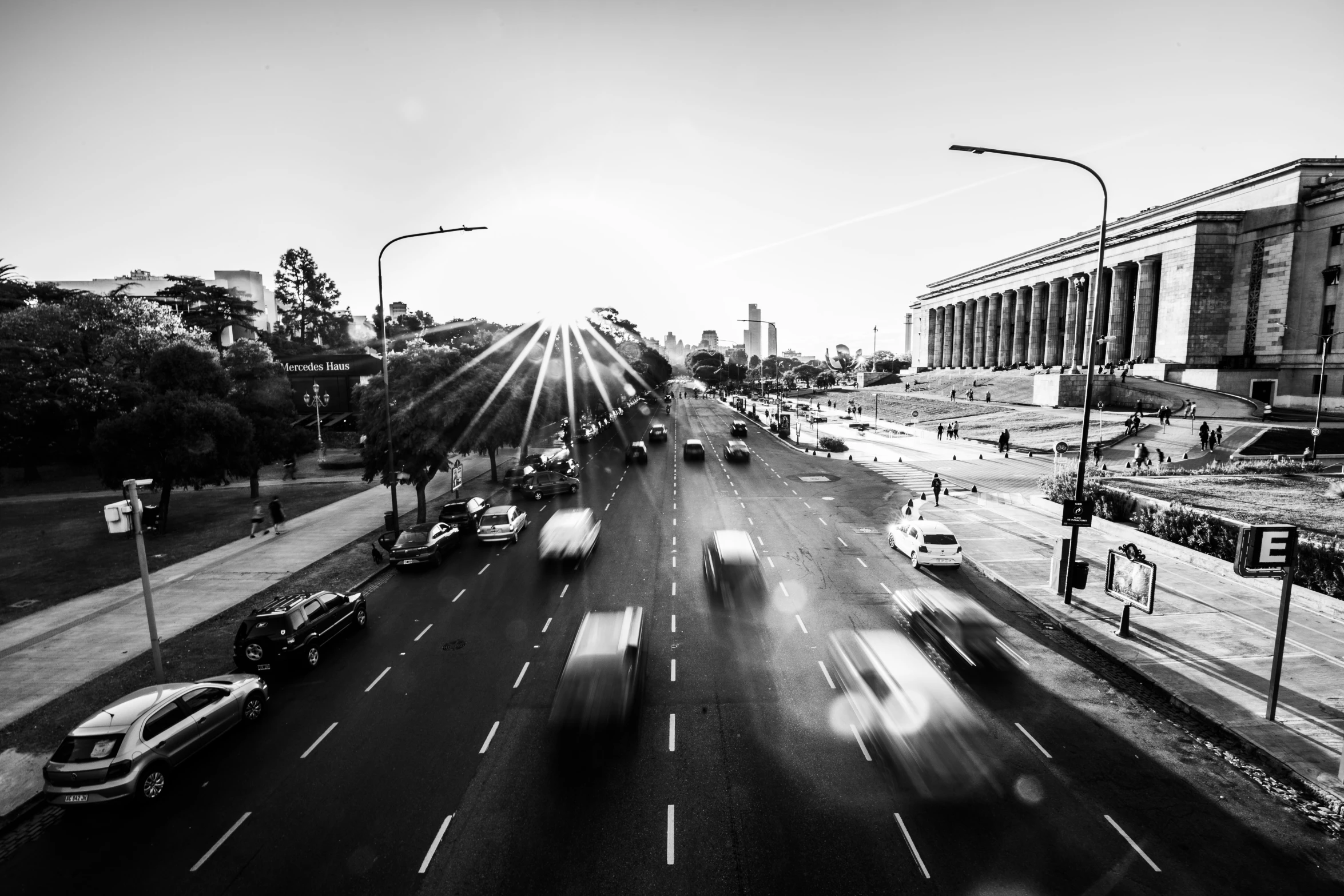 a black and white pograph of an interstate with traffic