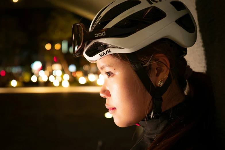 a woman wearing a helmet that has the number 33 on it