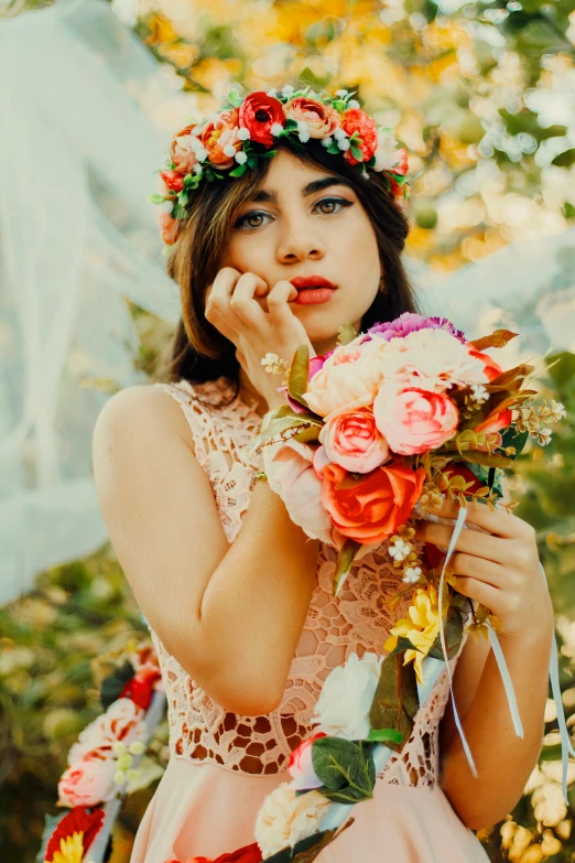 an asian lady wearing a flower crown holding flowers