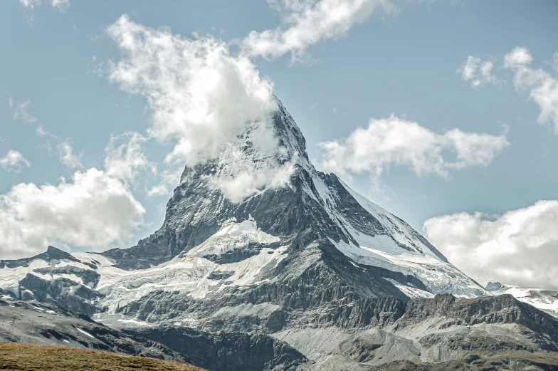 a very tall peak that is standing out from the other side of a field