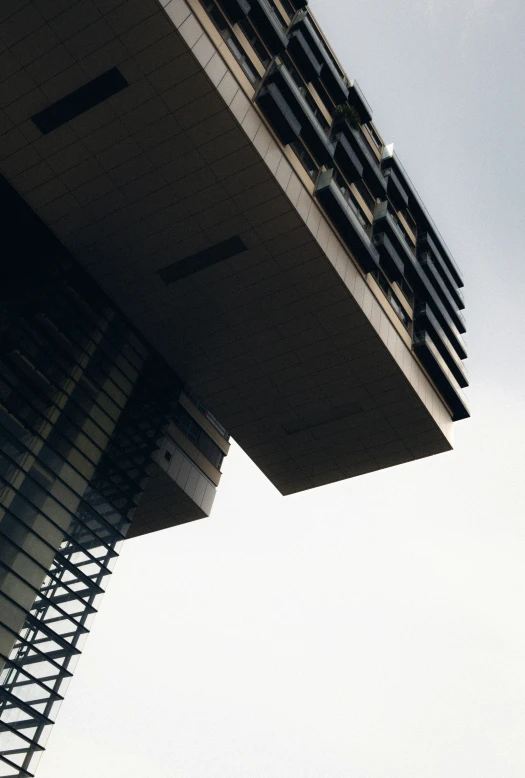 an air plane flying low over a tall building