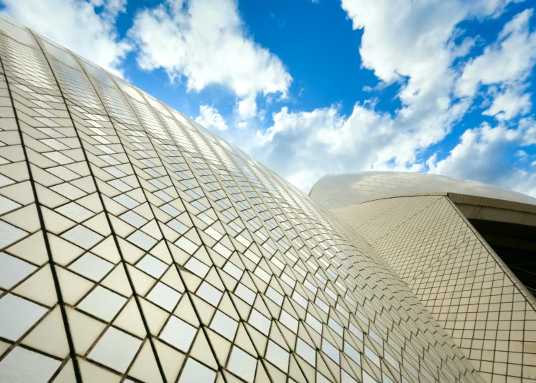 two building structure facing each other with cloudy sky background