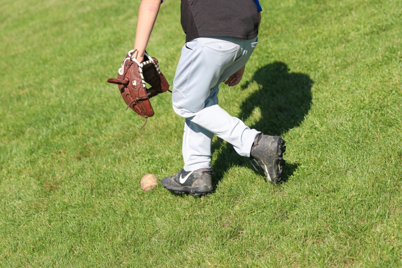 a person in the outfield getting ready to throw a baseball