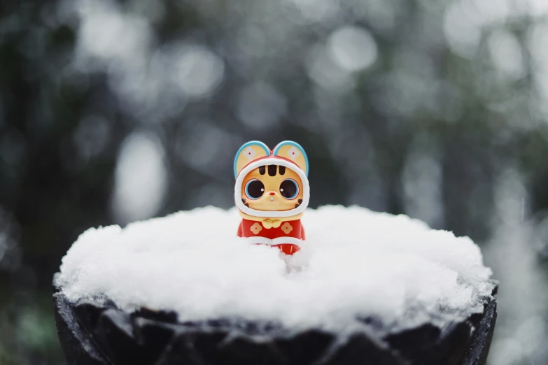 there is a small toy in the snow