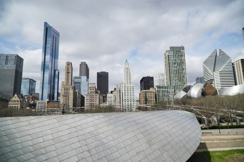 a man flying through the air while standing in front of a bunch of buildings