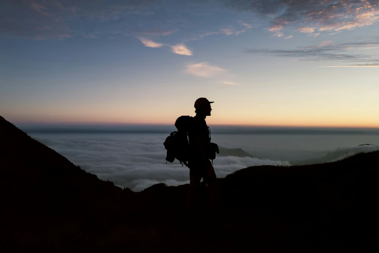 a man standing on top of a rocky mountain