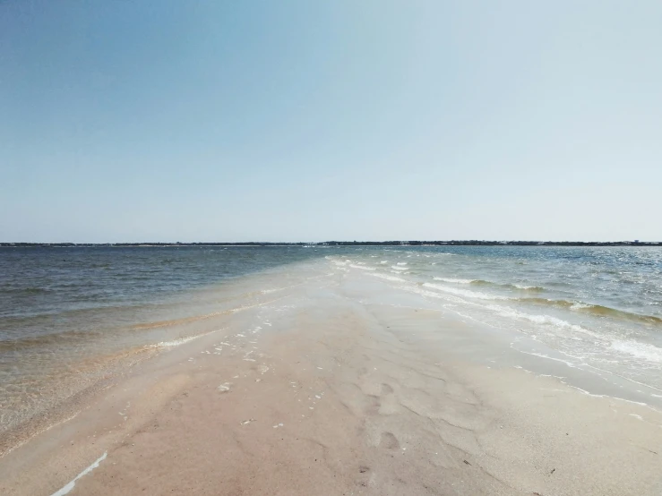 this is an ocean beach with some water on the beach