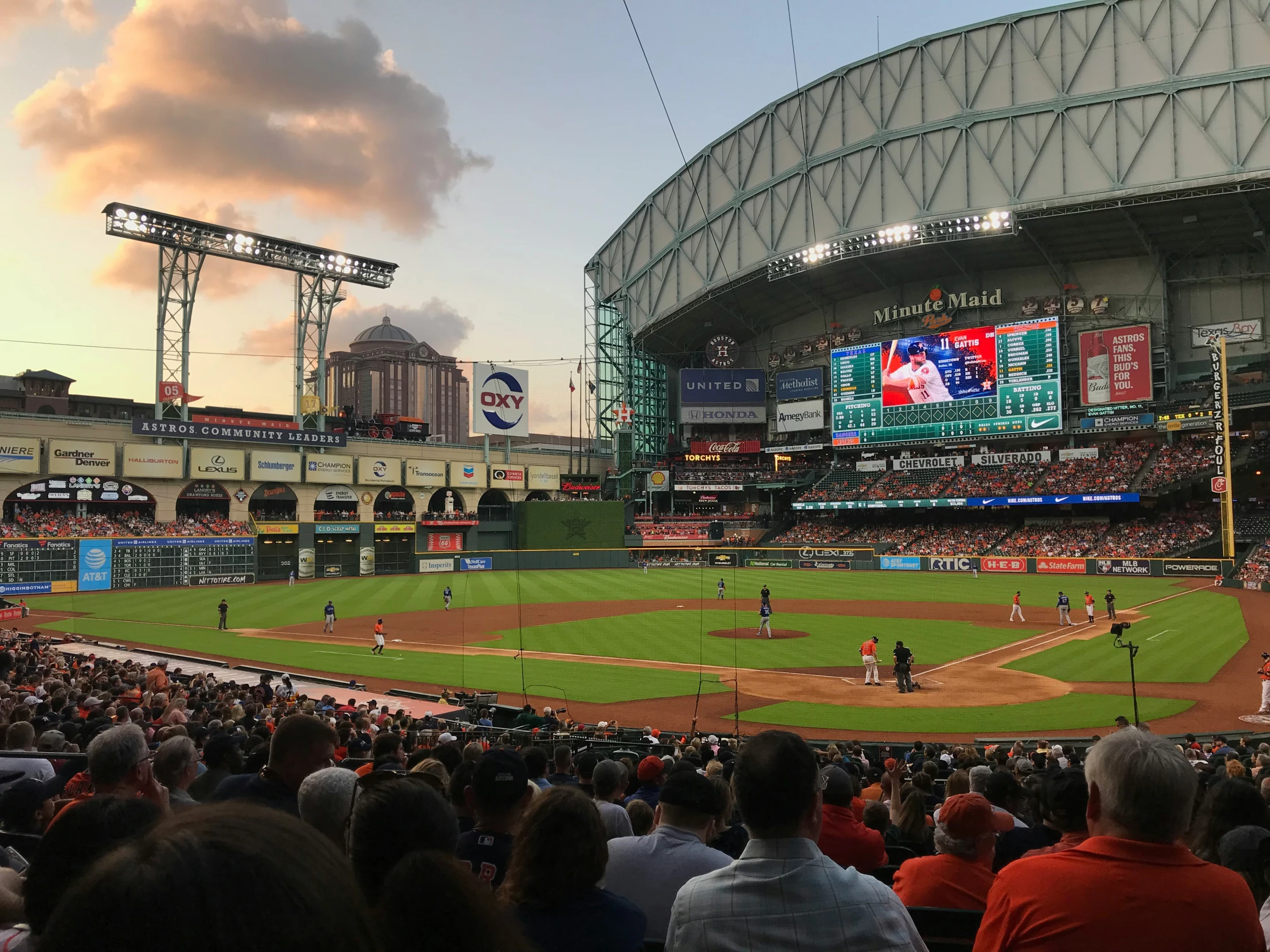 a stadium full of people standing on top of a field