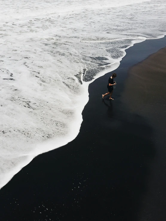 a person riding skis on top of a beach