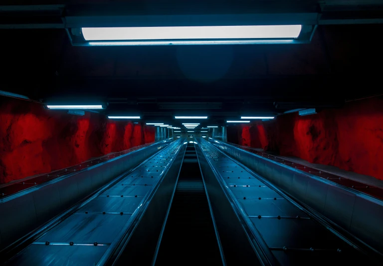 an empty train track in a subway station