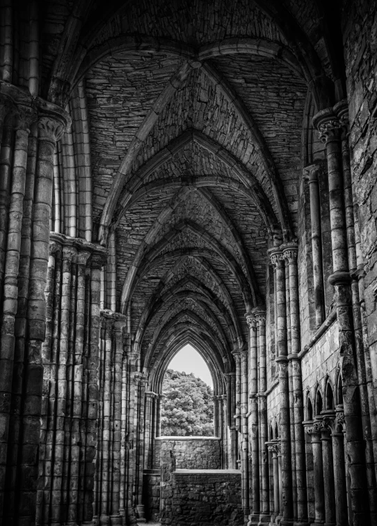 an arch leading to a large cathedral with arches