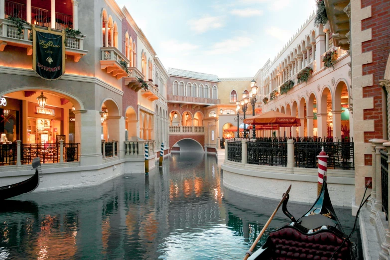 a boat passing through a building in a canal