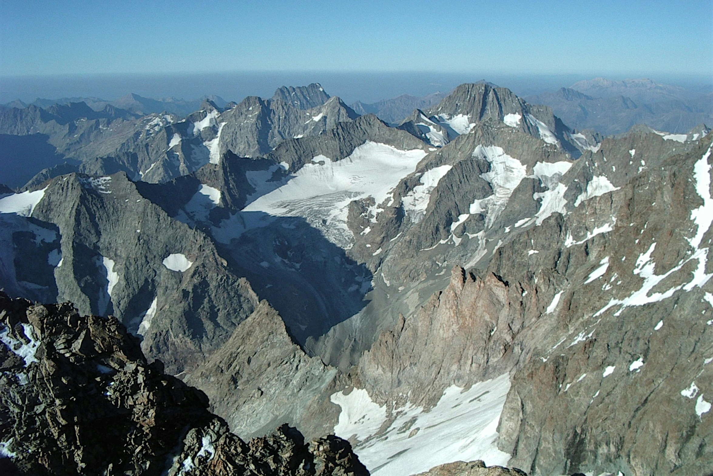 a large group of mountains covered in snow